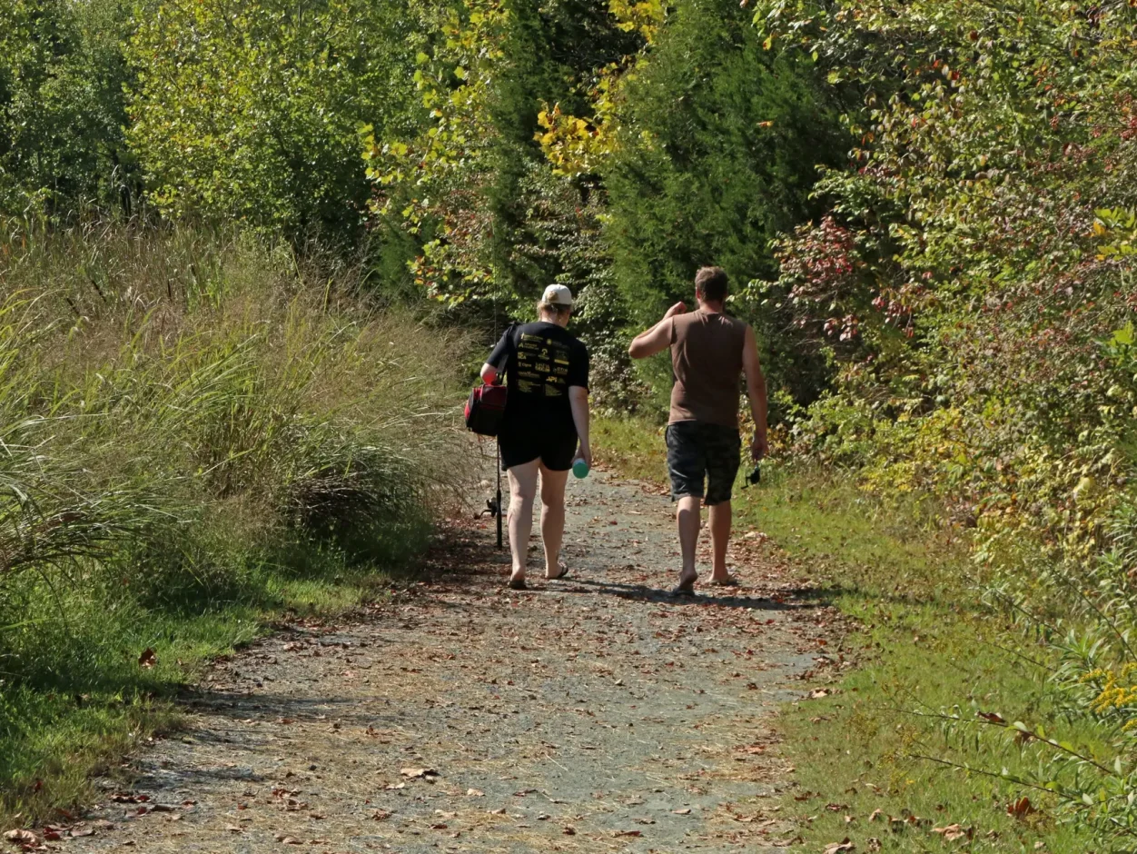 couple walking on jug bay trail